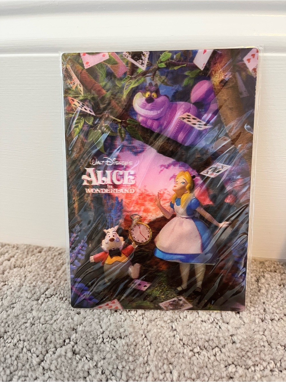 This item is a Disney Alice in Wonderland 3D lenticular postcard featuring Alice